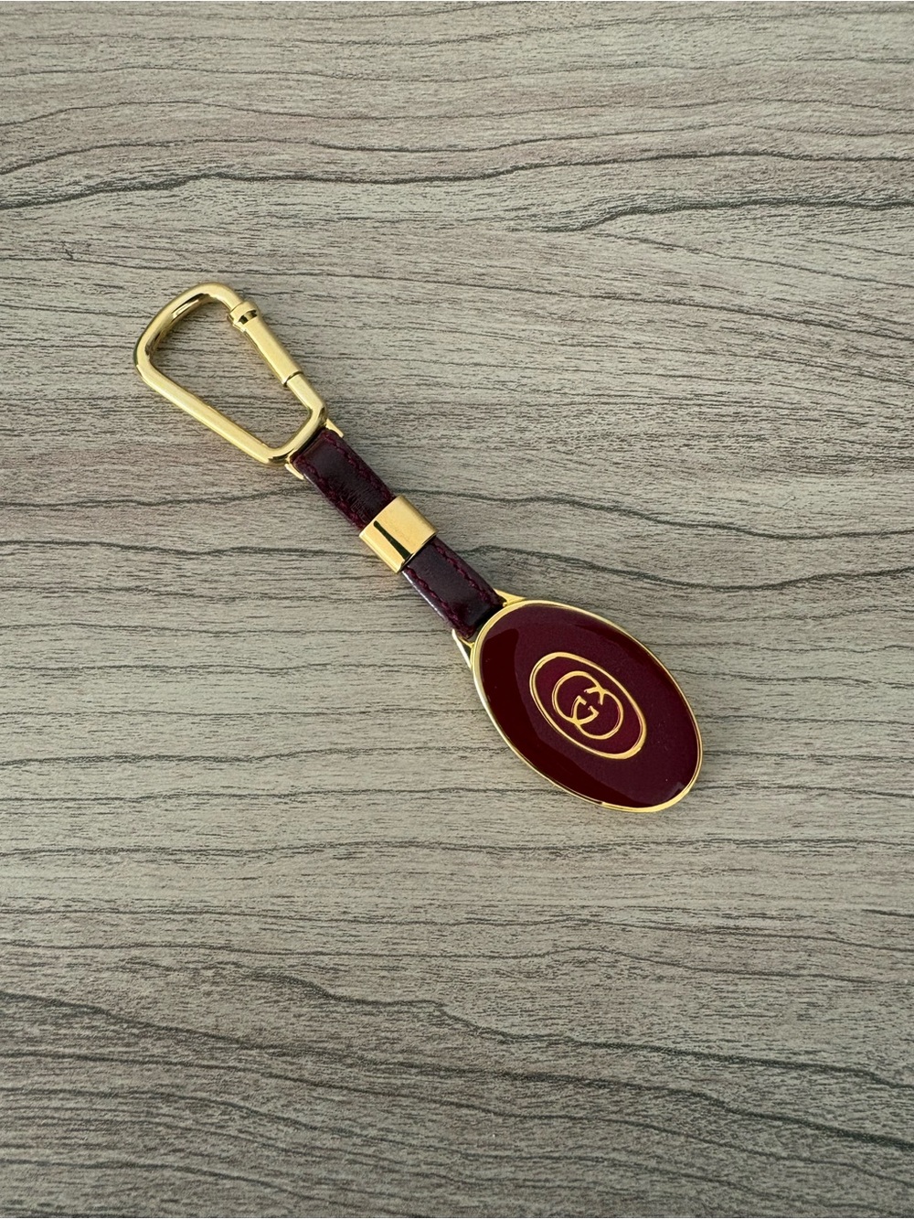 Gucci Burgundy Enamel Leather Oval Keychain Charm Gold Hardware